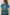 Teal t-shirt with a pink bow and 'Beauty from Ashes' text on the back, worn by a person.