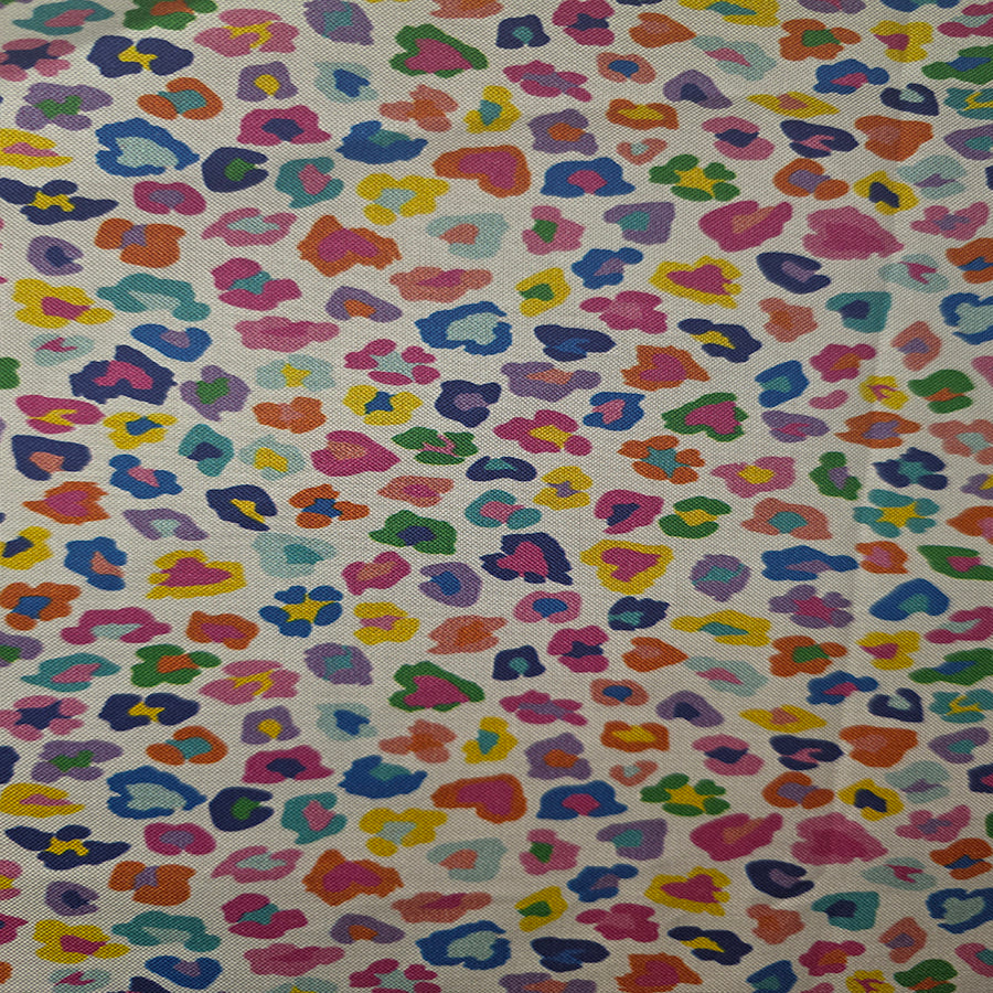 Multicolored leopard print pattern on a fabric background