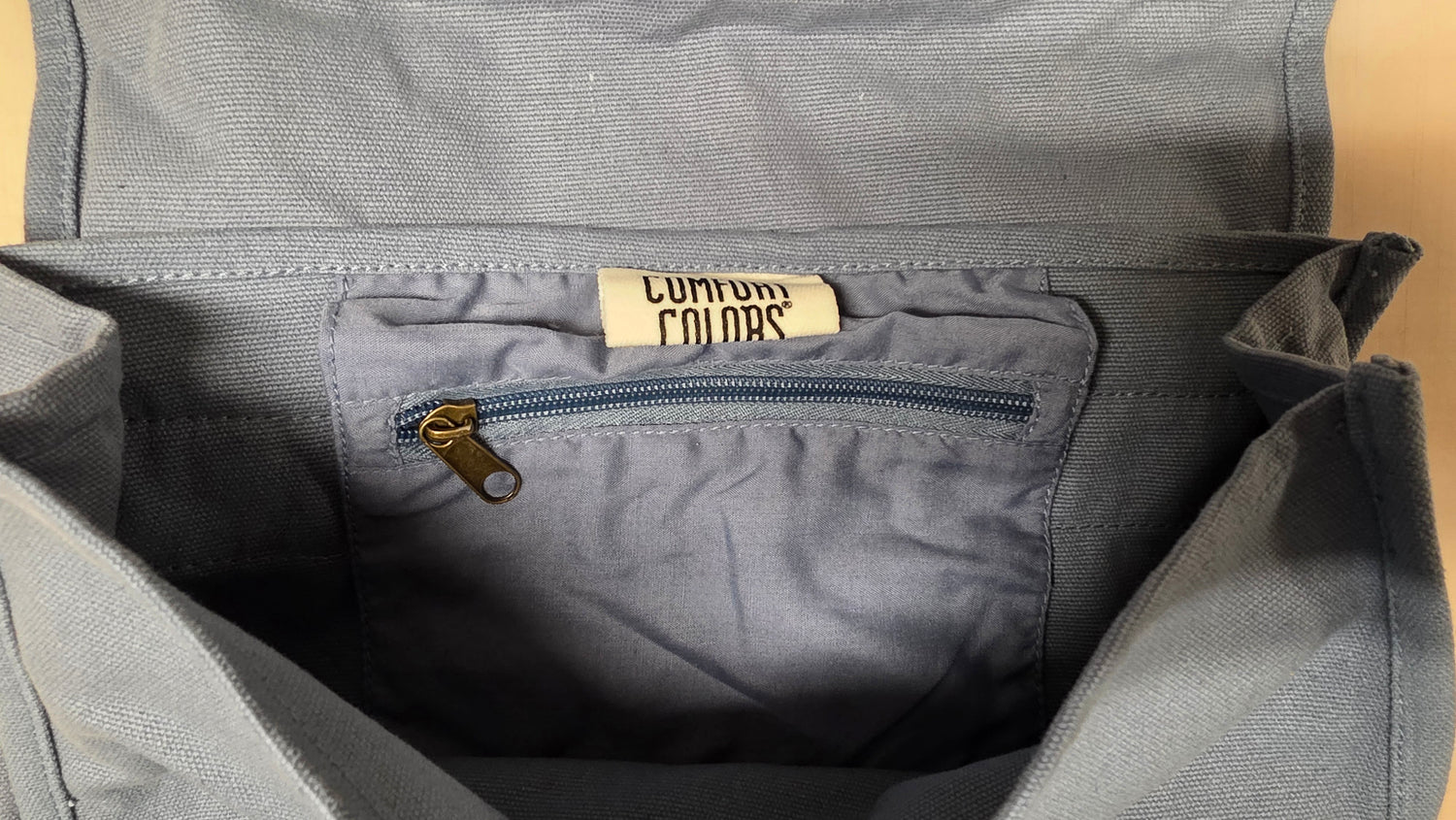 Grey cross-body bag.