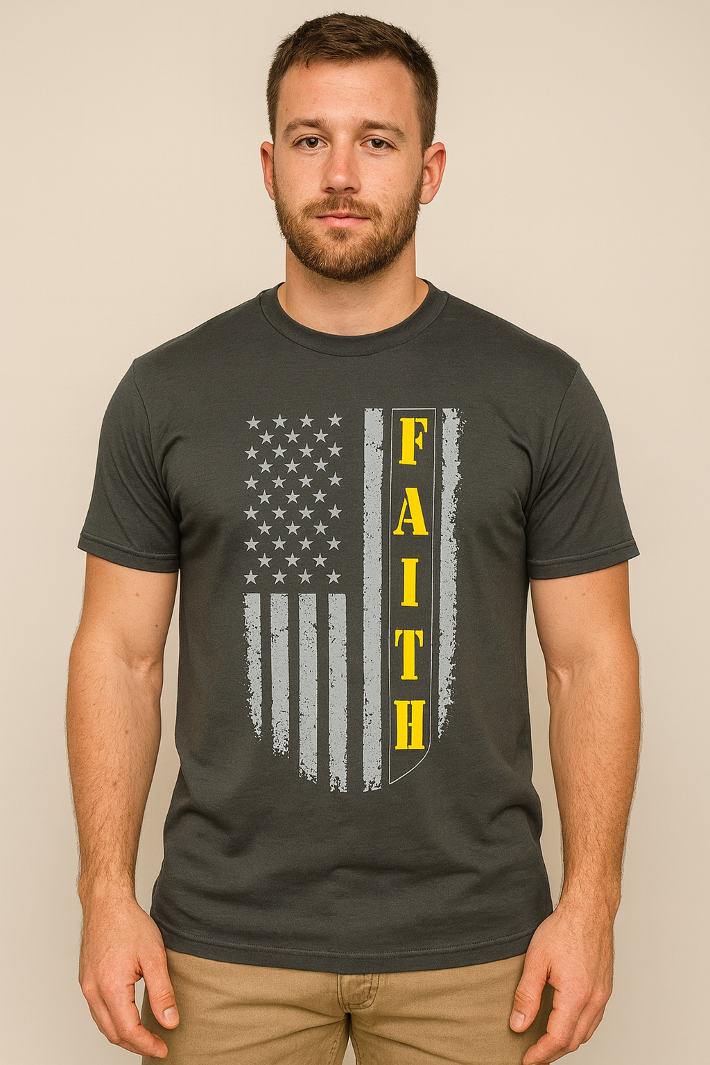Man wearing a dark gray t-shirt with an American flag design and the word 'FAITH' on a gray background