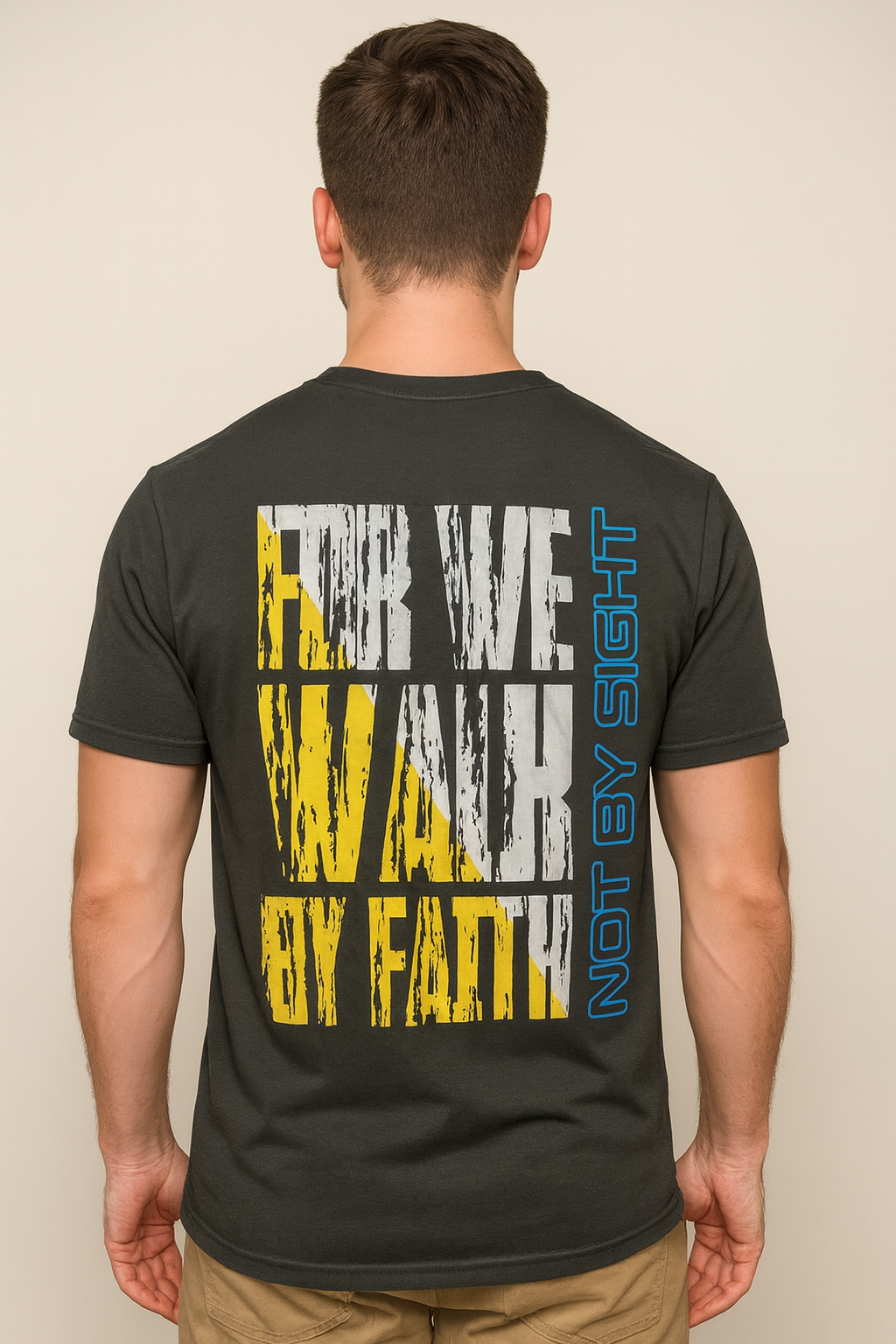 Person wearing a black t-shirt with "For we walk by Faith" print on the back.