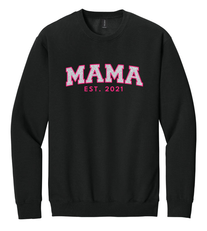 Black sweatshirt with 'MAMA EST. 2021' text in pink on a white background