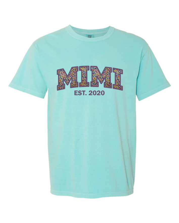 Mint t-shirt with 'MIMI EST. 2020' text on a white background