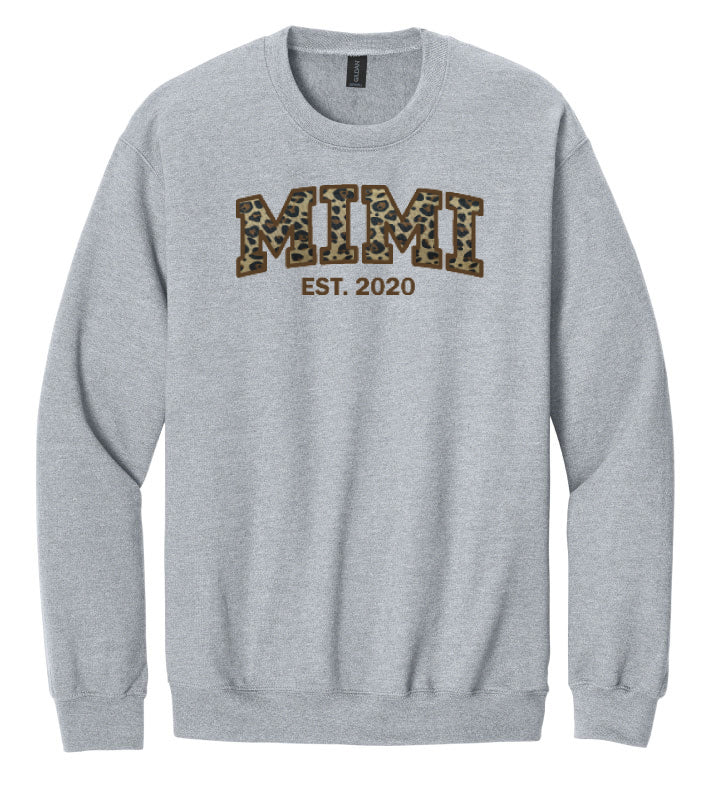 Gray sweatshirt with 'MIMI EST. 2020' text in leopard print on a white background