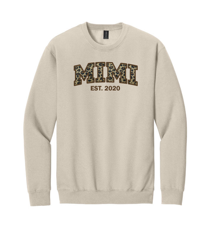 Beige sweatshirt with 'MIMI EST. 2020' text.