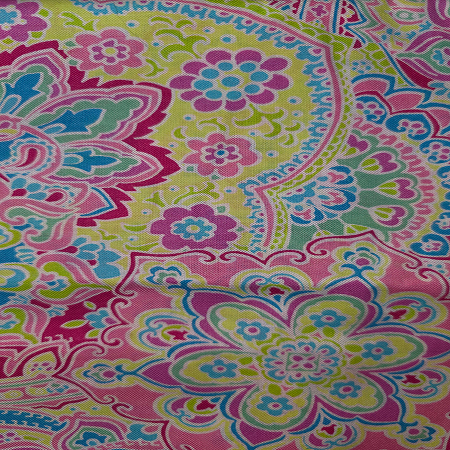Colorful paisley patterned fabric with pink, green, and blue colors.