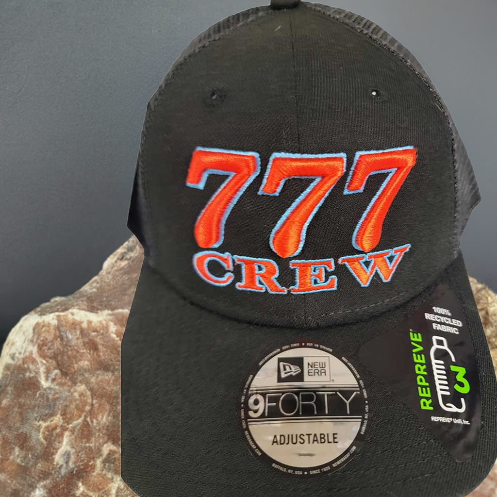 777 Crew 3D hat sitting on a rock
