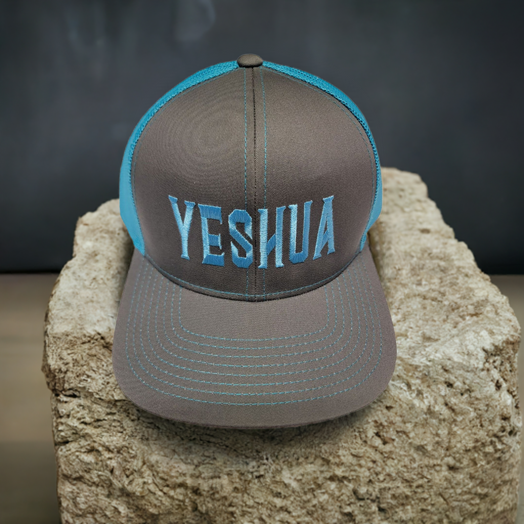 Yeshua hat sitting on a stone