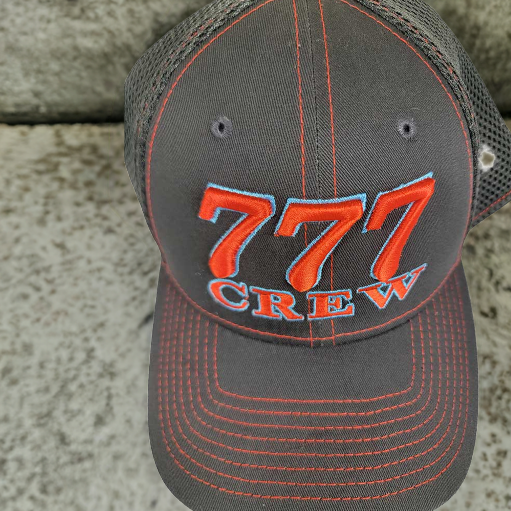 777Crew hat sitting on a rock